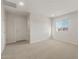 Spacious bedroom with carpet flooring and a window with neighborhood views at 17788 W Getty Dr, Goodyear, AZ 85338