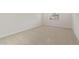 Spacious bedroom with neutral carpet, a bright window, and ample natural light at 17788 W Getty Dr, Goodyear, AZ 85338