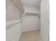 Walk-in closet with shelving and carpeted floors at 17788 W Getty Dr, Goodyear, AZ 85338