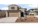 Charming two-story home featuring a neutral color palette, tile roof, and a two-car garage at 17788 W Getty Dr, Goodyear, AZ 85338