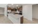 Modern kitchen boasts stainless appliances, granite countertops, and a spacious center island at 17788 W Getty Dr, Goodyear, AZ 85338