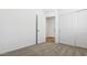 Bedroom with carpet, closet with sliding doors, and attached bath at 18377 W Gray Fox Trl, Wittmann, AZ 85361
