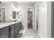Bathroom featuring double sinks, granite countertops, and a walk-in closet at 1980 E Horseshoe Dr, Chandler, AZ 85249