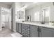 Elegant bathroom featuring dual sinks, granite countertops, and stylish gray cabinetry at 1980 E Horseshoe Dr, Chandler, AZ 85249