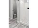 Bathroom with tiled walk-in shower, tile flooring, and adjoining water closet at 1980 E Horseshoe Dr, Chandler, AZ 85249