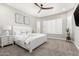 Bright bedroom featuring neutral decor, white furniture, plantation shutters, and ceiling fan at 1980 E Horseshoe Dr, Chandler, AZ 85249