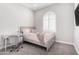 Cozy bedroom with stylish desk, chair and window, bathed in soft, natural light at 1980 E Horseshoe Dr, Chandler, AZ 85249