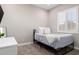 Bright bedroom featuring stylish bed, shuttered window, and a clean, modern aesthetic at 1980 E Horseshoe Dr, Chandler, AZ 85249