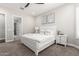 Cozy bedroom with white furniture, neutral carpet, and views to an en-suite bath and walk-in closet at 1980 E Horseshoe Dr, Chandler, AZ 85249