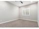 Spacious carpeted bedroom featuring modern recessed lighting and shuttered window at 1980 E Horseshoe Dr, Chandler, AZ 85249