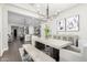Open-concept dining area with a modern table, bench seating, stylish decor, and an open view to the adjacent kitchen at 1980 E Horseshoe Dr, Chandler, AZ 85249