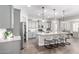 Bright kitchen featuring a large island, granite counters, stainless appliances and pendant lighting at 1980 E Horseshoe Dr, Chandler, AZ 85249
