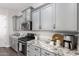 Kitchen details featuring gray cabinets, stainless steel appliances, and granite countertops at 1980 E Horseshoe Dr, Chandler, AZ 85249