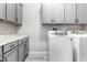 Laundry room boasts plentiful storage and counter space for all your cleaning needs at 1980 E Horseshoe Dr, Chandler, AZ 85249