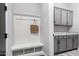 Mudroom offers storage cabinets, a bench and coat hooks for organization and convenience at 1980 E Horseshoe Dr, Chandler, AZ 85249