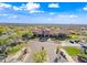 Community clubhouse aerial view showcasing architecture, manicured landscaping, parking, and mountain views at 2040 N Dome Rock --, Mesa, AZ 85207