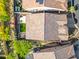 Aerial view of a home highlighting the roof, small grass yard, hardscape, and surrounding neighborhood at 2040 N Dome Rock --, Mesa, AZ 85207