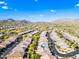 Aerial view of a quiet, desert community, displaying mountain views, well-maintained streets, and desert landscaping at 2040 N Dome Rock --, Mesa, AZ 85207