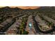 Wide aerial view showcasing desert community featuring mountain views, well-maintained streets, and desert landscaping at 2040 N Dome Rock --, Mesa, AZ 85207