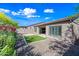 The backyard includes synthetic grass, a covered patio, pavers, and low-maintenance gravel landscaping at 2040 N Dome Rock --, Mesa, AZ 85207