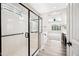 Clean bathroom with glass enclosed shower, soaking tub, white cabinets, and stylish fixtures at 2040 N Dome Rock --, Mesa, AZ 85207