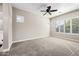 Bedroom featuring neutral walls, carpet flooring, shuttered windows, and ceiling fan at 2040 N Dome Rock --, Mesa, AZ 85207