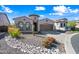 Charming single-Gathering home with a well-manicured front yard, three-car garage, and a turret accent at 2040 N Dome Rock --, Mesa, AZ 85207