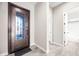 Foyer featuring decorative front door, neutral walls, tile flooring, and access to other rooms at 2040 N Dome Rock --, Mesa, AZ 85207