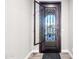 A foyer featuring a decorative iron door providing natural light and security at 2040 N Dome Rock --, Mesa, AZ 85207