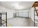 Spacious two car garage with sealed concrete floor, shelving, and white painted walls at 2040 N Dome Rock --, Mesa, AZ 85207
