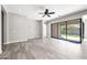 A large room with a ceiling fan, sliding glass doors to patio, and tile flooring throughout at 2040 N Dome Rock --, Mesa, AZ 85207