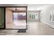 An open living area connected to an outdoor patio with a ceiling fan and lots of natural light at 2040 N Dome Rock --, Mesa, AZ 85207