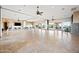 Large, open meeting room with tile floors, drop lighting, ceiling fans, and large windows at 2040 N Dome Rock --, Mesa, AZ 85207