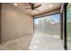 Covered patio featuring stone flooring, ceiling fan, and view of backyard with shade screen at 2040 N Dome Rock --, Mesa, AZ 85207