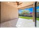 A covered outdoor patio featuring a ceiling fan and beautiful views of the desert landscaping at 2040 N Dome Rock --, Mesa, AZ 85207