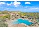 Community pool area with plenty of lounge chairs and seating at 2040 N Dome Rock --, Mesa, AZ 85207