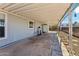 This back patio features an open porch and gravel landscaping at 2145 N Silverton St, Mesa, AZ 85203