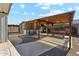 This backyard features a ramada with a picnic table at 2145 N Silverton St, Mesa, AZ 85203