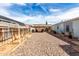 Spacious backyard with gravel area and covered patio space at 2145 N Silverton St, Mesa, AZ 85203