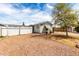 Charming home exterior with gravel landscaping, a white picket fence, and a lovely yard at 2145 N Silverton St, Mesa, AZ 85203