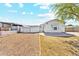 View of the side of the home with gravel yard and partial fencing at 2145 N Silverton St, Mesa, AZ 85203