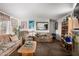 Cozy living room featuring neutral paint colors, an expansive bookcase and comfortable furniture at 2145 N Silverton St, Mesa, AZ 85203