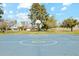 Community basketball court with vibrant blue surface, green accents, and mature trees at 2405 E Balboa Dr, Tempe, AZ 85282