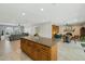 Open-concept kitchen with a large island and breakfast bar, seamlessly connecting to the living spaces at 2405 E Balboa Dr, Tempe, AZ 85282