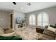 Cozy living room featuring neutral walls, arched windows and comfortable seating area with stylish rug at 2405 E Balboa Dr, Tempe, AZ 85282