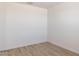 Neutral bedroom featuring wood-look floors, baseboards, and recessed ceiling lights at 25180 N 159Th Dr, Surprise, AZ 85387