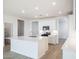 Open-concept kitchen featuring an island, stainless steel appliances, and plenty of natural light at 25180 N 159Th Dr, Surprise, AZ 85387
