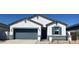 Charming single-story home featuring a two-car garage, low-maintenance landscaping, and a classic architectural design at 25356 W Sunland Ave, Buckeye, AZ 85326