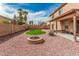 Large backyard featuring a fire pit, artificial turf, and covered patio with string lights at 3239 E San Manuel Rd, San Tan Valley, AZ 85143