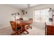 Dining room with wood table, chairs, and a bright window at 3239 E San Manuel Rd, San Tan Valley, AZ 85143